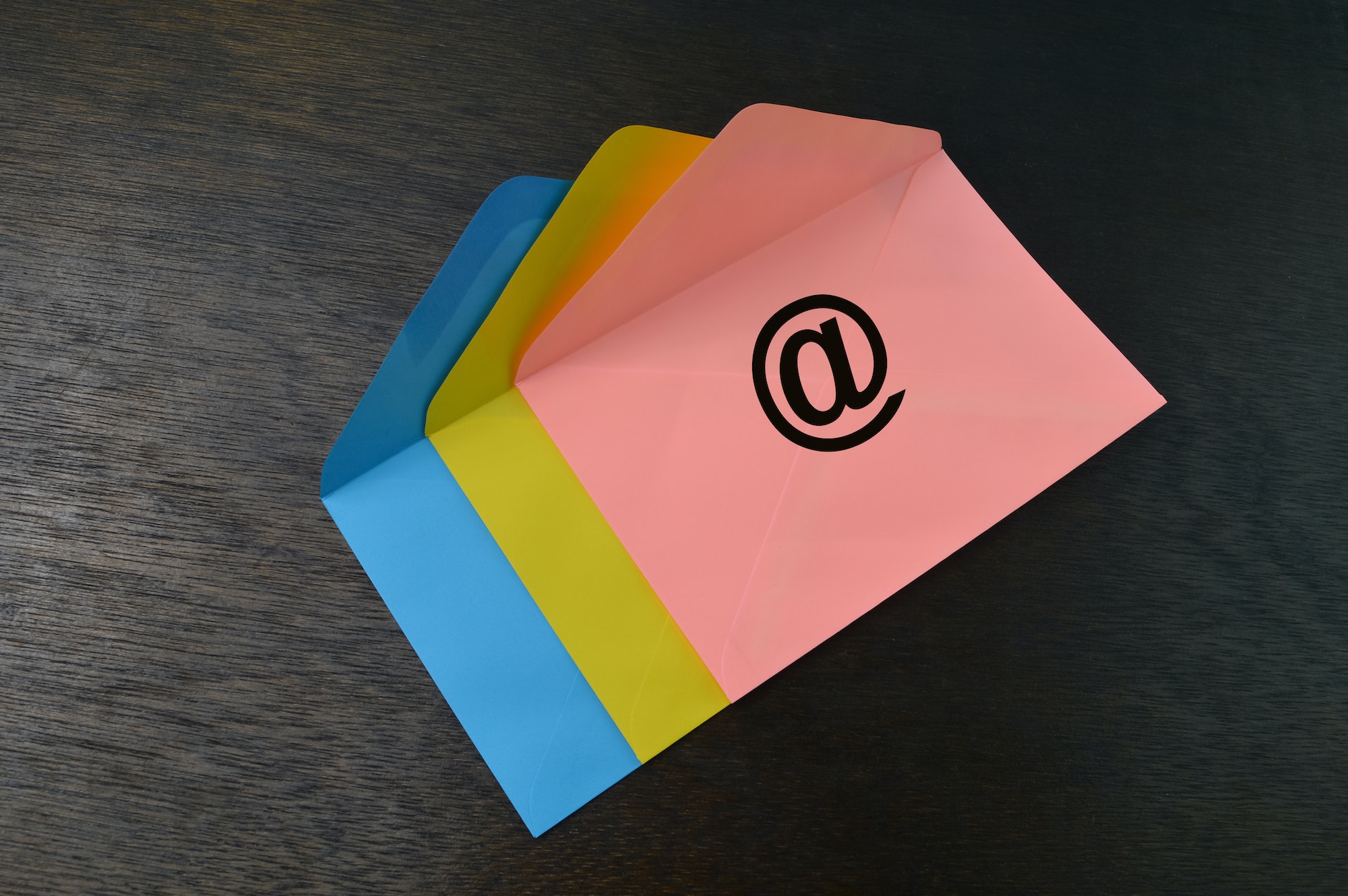 Colorful envelopes with email symbols. Social media concept.